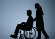 helping wheelchair moving patient